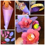 [Image Description: Five images detailing the steps required to make May-Day basket gifts. In the first image, a child’s hand rolls a piece of construction paper into a cone, leaving a large flap at the top. In the second, a construction paper handle has been attached to the wide top of the cone, and popcorn has filled it. In the third, the extra flap at the top has folded over the opening, forming a lid. In the fourth picture, oblong petals of different sizes have been cut out of construction paper. In the final image, the petals have been threaded on the sticks of lollypops, forming flowers.]