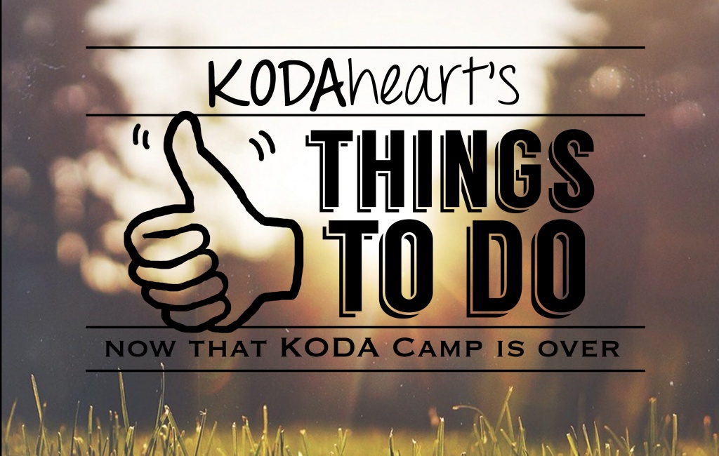 [Image Description: A thumb, outlined in black, signs “10” with accompanying text that reads: “KODAheart’s [10] things to do now that koda camp is over”. In the background is an image of a grassy field. Soft sunlight breaks through trees, lighting the grasses from behind.]