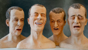 [Image description: Four bust sculptures of white middle aged men are displaying various emotions. The first on on the left bust depicts a man with his mouth slightly ajar. The second figure shows a man displaying a laugh, while the last two busts shows the emotions of anger and sadness.]