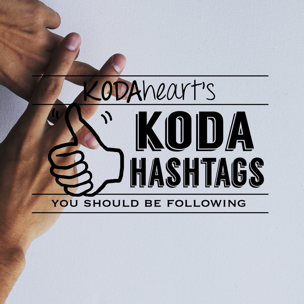 Image Description: A thumb, outlined in black, signs “10” with accompanying text that reads: “KODAheart’s [10] KODA hashtags you should be following” In the background, to the left of the picture are two hands, creating the ASL sign for hashtag.