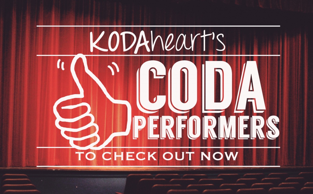 [Image Description: A thumb, outlined in black, signs “10” with accompanying text that reads: “KODAheart’s [10] CODA performers to check out now” In the background, rows of seats line the stage of a theatre.]