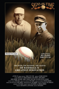 [Image description: Movie cover for Signs of the Time. Two sepia toned portraits of white men, wearing baseball caps, are highlighted above an image of a baseball nestled in a patch of grass. Text at the top of the cover reads, “Signs of the Time.” ]