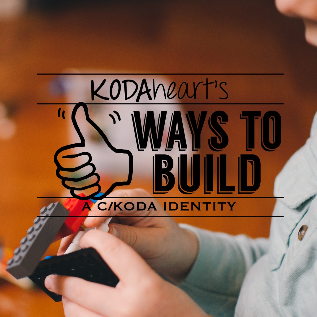 [Image Description: A thumb, outlined in black, signs “10” with accompanying text that reads: “KODAheart’s [10] Ways to build a c/koda identity”. In the background is a close up image of a child playing with colored legos, only the hands and a small part of the face visible.]