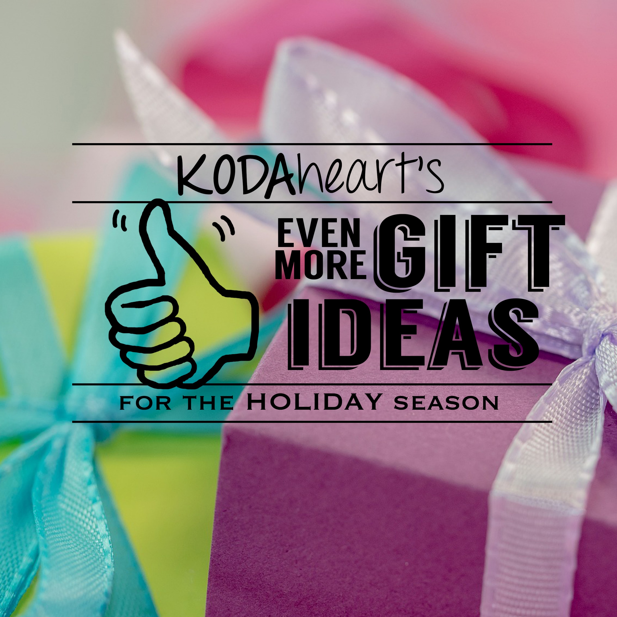 [Image description: A thumb, outlined in black, signs “10” with accompanying text that reads: “KODAheart’s [10] Even more gift ideas for the holiday season.” In the background is a closeup colorfully wrapped boxes with ribbon bows.]