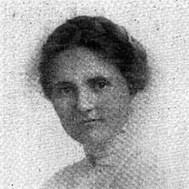 Image Description: A black and white newspaper image of a young white woman, wearing early twentieth century, white shirt Her hair, in a braid, is piled atop her head. She looks out from the photograph with a serious expression.